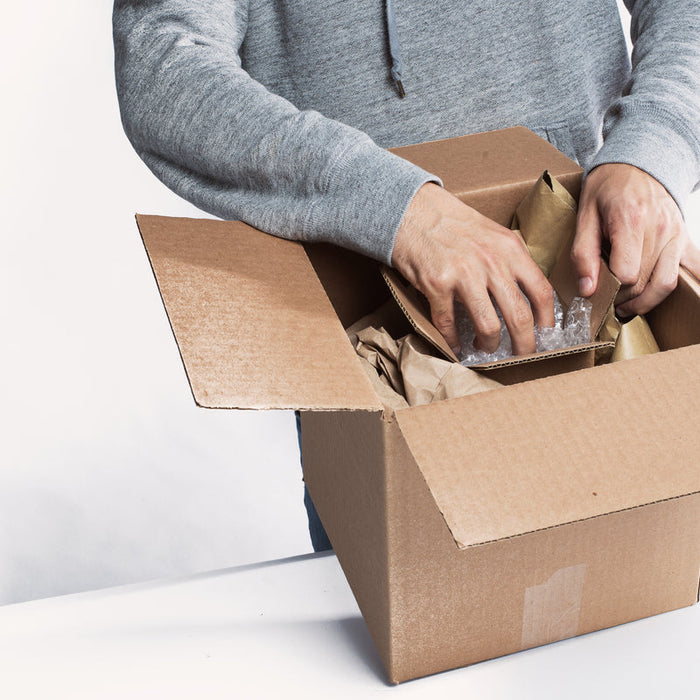 Careful wine packaging to prevent breakage in transit